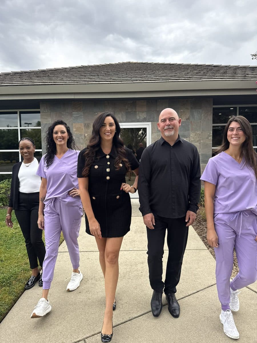 Home Care by Athena team members walking together outside the office